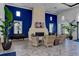 Stylish lounge area with modern seating, fireplace, TV, and elegant decor, perfect for relaxing and socializing at 13513 Deep Blue Pl, Bradenton, FL 34211