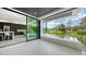 Balcony with jacuzzi and seamless indoor-outdoor flow to modern kitchen, offering relaxing outdoor entertainment space at 1610 N Lodge Dr, Sarasota, FL 34239