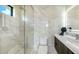 Stylish bathroom featuring marble accents, a walk-in shower, and a modern vanity with unique decor at 1610 N Lodge Dr, Sarasota, FL 34239