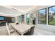 Bright dining space with modern furnishings, large windows offering natural light, and contemporary artwork at 1610 N Lodge Dr, Sarasota, FL 34239