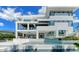 Stunning modern home with a multi-level deck, outdoor kitchen, and beautiful pool overlooking the water at 1610 N Lodge Dr, Sarasota, FL 34239
