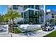 Contemporary home with manicured lawn, stylish driveway, and a modern glass-enclosed entrance at 1610 N Lodge Dr, Sarasota, FL 34239