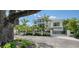 Contemporary home with gated entry, mature trees, and clean lines for an elegant curb appeal at 1610 N Lodge Dr, Sarasota, FL 34239