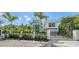 Modern home with a gated entrance, lush landscaping, and a sleek exterior design for ultimate privacy at 1610 N Lodge Dr, Sarasota, FL 34239