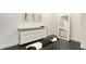 Stylish hallway with a mirrored dresser, modern bench and artwork that enhances the space at 1610 N Lodge Dr, Sarasota, FL 34239