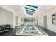 Bright hallway with clear ceiling and open floor plan, overlooking the first floor and outside pool at 1610 N Lodge Dr, Sarasota, FL 34239