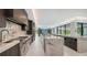Contemporary kitchen with stainless steel appliances, marble countertops, and lots of natural light at 1610 N Lodge Dr, Sarasota, FL 34239