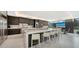 Modern kitchen with a large island, stainless steel appliances, and sleek, dark wood cabinetry at 1610 N Lodge Dr, Sarasota, FL 34239