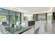 Open-concept kitchen and dining area featuring marble countertops and an open floor plan at 1610 N Lodge Dr, Sarasota, FL 34239