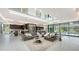 Bright, open-concept living room with modern furnishings and floor-to-ceiling windows showcases the stunning views at 1610 N Lodge Dr, Sarasota, FL 34239