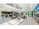 Open-concept living space features modern furnishings, large windows, and seamless indoor-outdoor living at 1610 N Lodge Dr, Sarasota, FL 34239
