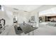 Contemporary office space with glass desk and modern decor, flowing into a bright, open floor plan with wine storage at 1610 N Lodge Dr, Sarasota, FL 34239