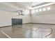 Indoor basketball court with polished floors, basketball hoop, and cushioned wall padding for safety at 16231 Tradewind Ter, Bradenton, FL 34211