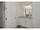 This bathroom features a white vanity with storage and a large mirror at 16231 Tradewind Ter, Bradenton, FL 34211