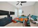 Bedroom with two beds, ceiling fan, and lots of natural light at 16231 Tradewind Ter, Bradenton, FL 34211