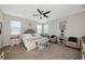 Spacious bedroom with neutral decor, ceiling fan, and lots of natural light at 16231 Tradewind Ter, Bradenton, FL 34211