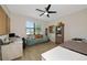 Comfortable bedroom with natural light, a ceiling fan, and a cozy atmosphere at 16231 Tradewind Ter, Bradenton, FL 34211