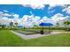 Bocce ball courts with shaded seating, offering a relaxing outdoor activity in a well-maintained area at 16231 Tradewind Ter, Bradenton, FL 34211