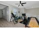 This home features an exercise room with an inversion table, weights, stationary bike, and shuffleboard at 16231 Tradewind Ter, Bradenton, FL 34211