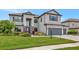 Beautiful two-story home with well-maintained landscaping, covered entryway, and a two car garage at 16231 Tradewind Ter, Bradenton, FL 34211
