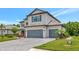 Beautiful two-story home with a three-car garage and professionally landscaped yard at 16231 Tradewind Ter, Bradenton, FL 34211
