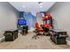 Fun game room featuring classic arcade games and vibrant wall art at 16231 Tradewind Ter, Bradenton, FL 34211