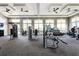 Community gym featuring stationary bikes and weight machines with views through large windows at 16231 Tradewind Ter, Bradenton, FL 34211