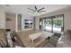 Bright living room boasts large windows and an electric fireplace, flowing to the outdoor pool area at 16231 Tradewind Ter, Bradenton, FL 34211