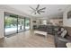 Open floor plan featuring a large living area flowing into the kitchen, with access to the outdoor pool at 16231 Tradewind Ter, Bradenton, FL 34211