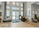 Bright lobby featuring high ceilings, large windows, stylish decor, and a welcoming entrance at 16231 Tradewind Ter, Bradenton, FL 34211