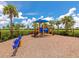 Colorful playground with equipment for children, set in a fenced area with soft ground cover at 16231 Tradewind Ter, Bradenton, FL 34211