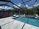 Inviting screened pool and jacuzzi spa with ample seating, perfect for outdoor relaxation and entertainment at 16231 Tradewind Ter, Bradenton, FL 34211