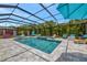 Large screened-in pool area with lounge chairs, spa and outdoor living area at 16231 Tradewind Ter, Bradenton, FL 34211