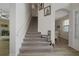 Inviting staircase with carpeted steps and an open landing, connecting the home's levels at 16231 Tradewind Ter, Bradenton, FL 34211
