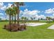 Sand volleyball court surrounded by green grass, perfect for community gatherings and friendly games at 16231 Tradewind Ter, Bradenton, FL 34211