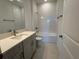 Bathroom featuring a sink with marble counter and a shower-tub combination at 17134 Savory Mist Cir, Bradenton, FL 34211