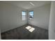 A bedroom with carpet and a view to the outside at 17134 Savory Mist Cir, Bradenton, FL 34211