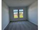A bedroom with carpet and a view to the outside at 17134 Savory Mist Cir, Bradenton, FL 34211