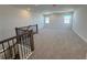 Upper floor bonus room view from staircase featuring wall-to-wall carpeting at 17134 Savory Mist Cir, Bradenton, FL 34211