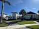 Stunning clubhouse featuring modern architecture, lush landscaping, and inviting walkway at 17134 Savory Mist Cir, Bradenton, FL 34211