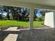 View of the patio, providing an extended outdoor living space overlooking a well-maintained yard and lush green landscape at 17134 Savory Mist Cir, Bradenton, FL 34211