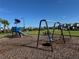 Fun community playground with swings and climbing structures at 17134 Savory Mist Cir, Bradenton, FL 34211