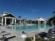 Resort-style pool with lounge chairs and umbrellas at 17134 Savory Mist Cir, Bradenton, FL 34211