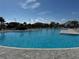 Large community pool featuring crystal clear blue water at 17134 Savory Mist Cir, Bradenton, FL 34211