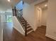 Staircase with wood steps and railing leading to the upper floors at 17134 Savory Mist Cir, Bradenton, FL 34211