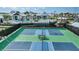 A high-angle shot of the community tennis courts, adjacent to other amenities such as pool and playground at 17134 Savory Mist Cir, Bradenton, FL 34211