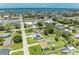 Aerial shot of a home near the water, showcasing the neighborhood's layout and proximity to the coast at 2026 Arkansas Ave, Englewood, FL 34224