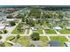 This aerial shot captures a quiet neighborhood with tidy yards, mature trees, and convenient road access at 2026 Arkansas Ave, Englewood, FL 34224
