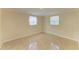 Cozy bedroom with neutral walls and unique flooring at 2026 Arkansas Ave, Englewood, FL 34224