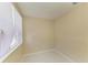 A compact bedroom space with natural light and tile flooring at 2026 Arkansas Ave, Englewood, FL 34224